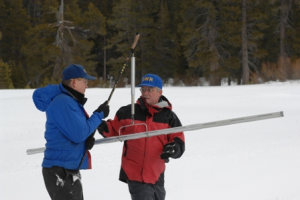 Snowpack surveys like the one pictured in this file photo are taking place to determine snow levelsa and the impact on the drought.